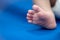 Newborn& x27;s foot on blue blanket sheet, Baby and Health care concept