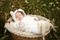 Newborn sleeping in a basket