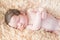 Newborn sleeping on a soft blanket. gentle sleeping newborn baby on a light background