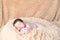 Newborn sleeping on a soft blanket. gentle sleeping newborn baby on a light background