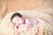 Newborn sleeping on a soft blanket. gentle sleeping newborn baby on a light background