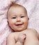 Newborn smiling baby