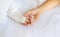 Newborn toddler holds his sister\'s hand. Selective focus