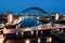 Newcastle Gateshead Quayside at night, with of Tyne Bridge and city skyline