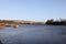 Newcastle UK: Jan 2022: Newburn Riverside at the River Tyne,  waves on a windy day with the A1 motorway bridge n