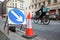 Newcastle UK: Oct 2021: roadworks in Newcastle city centre with an Deliveroo fast food delivery cycle rider moving past fast