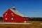 A newer bright red barn