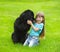 Newfoundland dog kisses a girl