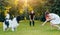 Newfoundland dog plays with man and woman