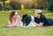 Newfoundland dog plays with man and woman