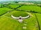 Newgrange, a prehistoric monument built during the Neolithic period, located in County Meath, Ireland