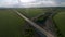 Newly built highway that passes through green field