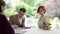 newly made groom sign marriage agreement ceremony with beautiful red-haired bride. man enters into marriage with woman