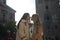 Newly married lesbian couple on a honeymoon in a city. The women are showing their love in public by walking around the city and