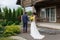 Newly married ready to enter in luxurious wooden mansion
