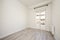 Newly painted room with bay window, wooden floors, radiator and black