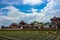 Newly planted farmland and Chinese style rooftops of the old Huwei Chifa Matsu Temple in Yunlin County, Taiwan