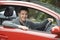 Newly Qualified Teenage Boy Driver Sitting In Car