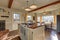 Newly renovated Kitchen boasts wood beams on ceiling