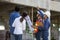 Newly wed couple is meeting with engineering contractor at their under construction house to inspect the building progress and