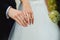 Newly wed couple\'s hands with wedding rings