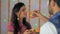 Newly-wed Indian couple happily performing Karwa Chauth rituals together