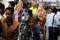 A newly wedded couple travels on a cycle rickshaw