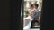 Newlywed bride and groom embracing on the balcony of old gothic cathedral