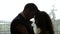 Newlywed couple silhouetted touching foreheads in love, quiet moment, marriage. HD 24FPS.