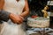 Newlywed couple slicing the wedding cake