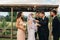 Newlywed couple about to kiss after the ceremony