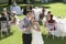 Newlywed Couple Toasting Champagne In Garden