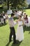 Newlywed Couple Toasting Champagne In Garden