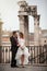 Newlyweds in the ancient city. Happy married couple. Rome, Italy.