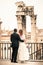 Newlyweds in the ancient city. Happy married couple. Rome, Italy.