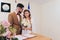 Newlyweds append signatures in a registry office during wedding registration.