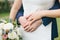 Newlyweds. Bride and groom hug each other. Hands with wedding rings close-up.