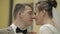 Newlyweds. Caucasian groom with bride making a kiss. Wedding couple. Man and woman in love