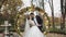 Newlyweds. Caucasian groom with bride near acres of flowers. Wedding couple