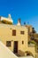 Newlyweds couple on cliffside villa rooftop Santorini island Greece