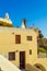 Newlyweds couple on cliffside villa rooftop Santorini island Greece