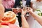 Newlyweds drink champagne with guests