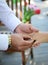Newlyweds exchange rings, groom puts the ring on the bride\'s hand