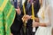 Newlyweds exchange wedding rings on a ceremony in the church