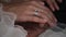 Newlyweds hands with rings