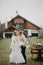 Newlyweds kiss on background of banquet table