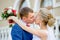 Newlyweds kiss at shallow depth of field