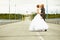 Newlyweds kissing passionately on highway