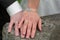 Newlyweds laid hands on each other