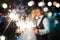 Newlyweds in love. Beautiful colorful blurry fireworks in the night